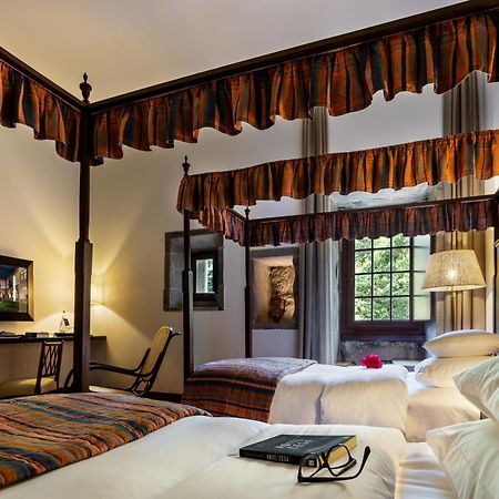 بوسادا موستيرو دي جويمارايس - فندق مونيومنت غيمارايش المظهر الخارجي الصورة A room at the hotel